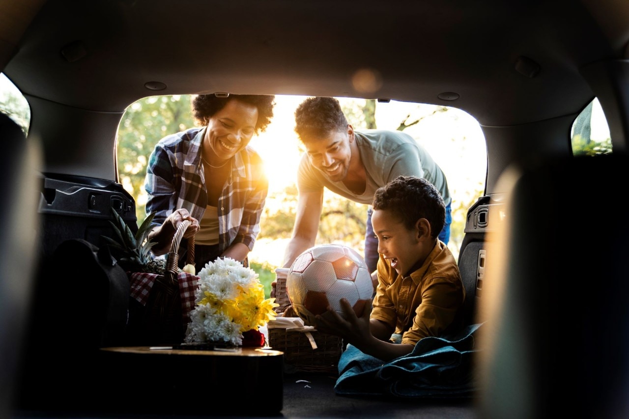 Child drawing on car window